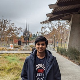 smiling young man on campus