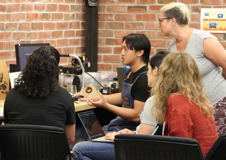small group of students working directly with instructor